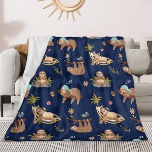 Sloth blanket depicts cute, sleepy, lounging sloths.